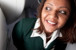 A flight attendant glances out the window in anticipation of the airstairs after arriving to Dulles International Airport in Washington DC. (Photo by Jeremy Dwyer-Lindgren)