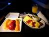 Breakfast with fresh fruit; three cheese omelet, basil pesto potatoes, roasted tomatoes, and turkey sausage.