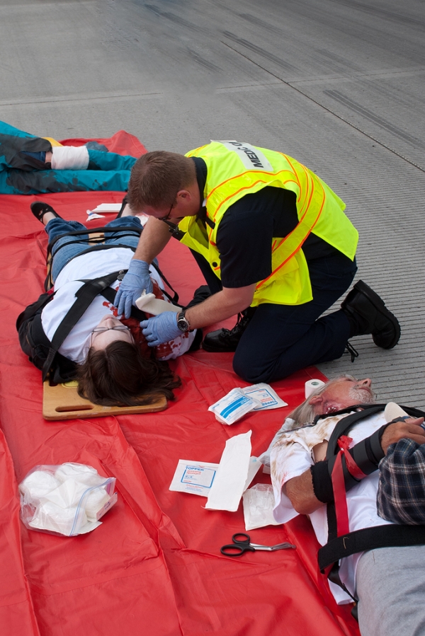 A rescuer treats a victim.