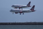 Two Virgin America planes fly a parallel approach to San Francisco. (Photo by Jun Seita via Flickr)