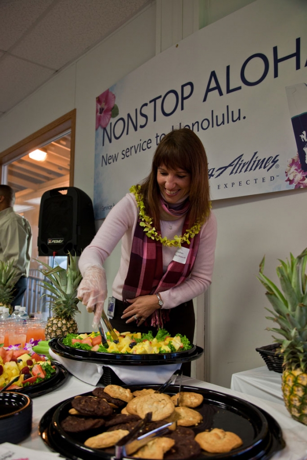 Lisa Luchau , Director, On Board Food and Beverage at Alaska Airlines greets guest with a few pre-flight refreshments and yes, pineapple was served.