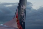 Famous Native Alaskan on Alaska Airlines planes wears a lei in honor of the new Hawaii flights.