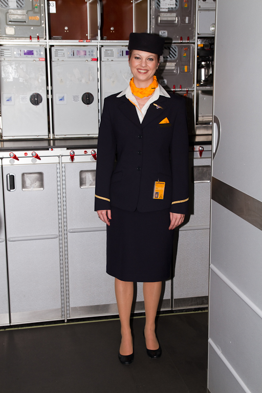 Lufthansa flight attendant, still looking chipper after over 11 hours on duty. (Photo by Eric Dunetz/NYCAviation)