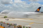 At 1:40pm, the German giant settled on the runway and taxied through a welcoming water cannon salute provided by four Miami-Dade Fire Department fire tenders to the terminal. (Photo by Mark Lawrence)
