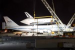 NASA and United Space Alliance technicians prepare to demate Space Shuttle Enterprise from the NASA Shuttle Carrier Aircraft. (Photo by Eric Dunetz)