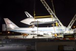 Space Shuttle Enterprise is lifted off of the Shuttle Carrier Aircraft using two cranes. (Photo by Eric Dunetz)