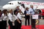 Mayor Sam Adams praises the Virgin America flight experience during remarks post arrival. (Photo by Jeremy Dwyer-Lindgren/NYCAviation)