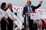 Virgin America CEO & President David Cush delivers remarks post flight flanked by VX flight attendants. (Photo by Jeremy Dwyer-Lindgren/NYCAviation)