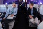 The two Portland mayors (real Portland mayor Sam Adams, left and 'Portlandia' mayor actor Kyle MacLachlan) chat in first class. (Photo by Jeremy Dwyer-Lindgren/NYCAviation)