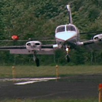 A plane lands on the resurfaced runway at Wiliamson-Sodus Airport near Lake Ontario in upstate New York. The airport is owned by the private Williamson Flying Club. Photo by CBS News
