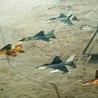 Coalition aircraft in formation over Saudi Arabia during Operation Desert Shield. From left to right: Qatari F-1 Mirage, French F-1C Mirage, US Air Force F-16C Fighting Falcon, Canadian CF/A-18A Hornet and Qatari Alpha Jet. (Photo by US Air Force/Staff Sgt. Lee Corkran)