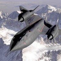 An SR-71B Blackbird, NASA 831, slices across the snow-covered southern Sierra Nevada Mountains of California after being refueled by an Air Force tanker during a 1994 flight. SR-71B was the trainer version of the SR-71. Notice the dual cockpit to allow the instructor to fly the airplane. (Photo by NASA)