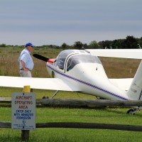 A Burkhart Grob glider (N404DW) basks in the sun at Katama Airpark, Marthas Vineyard, Mass. (Photo by Matt Molnar)