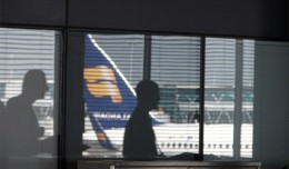 Reflection of an Icelandair Boeing 757 in an Amsterdam Schiphol window.
