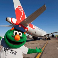 Wally the Green Monster poses with JetBlue's new Red Sox ship, Airbus A320 tail number 605 (N605JB). (Photo by JetBlue)