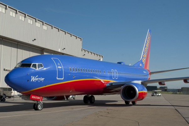 Southwest's first Boeing 737-800 N8301J Warrior One, taxis to its welcoming party.