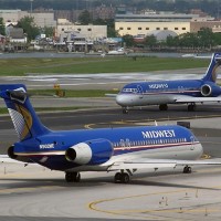 Two Midwest Airlines Boeing 717s, N902ME and sister ship N904ME, taxiing to their gates at LaGuardia Airport. (Photo by Ron Peel)