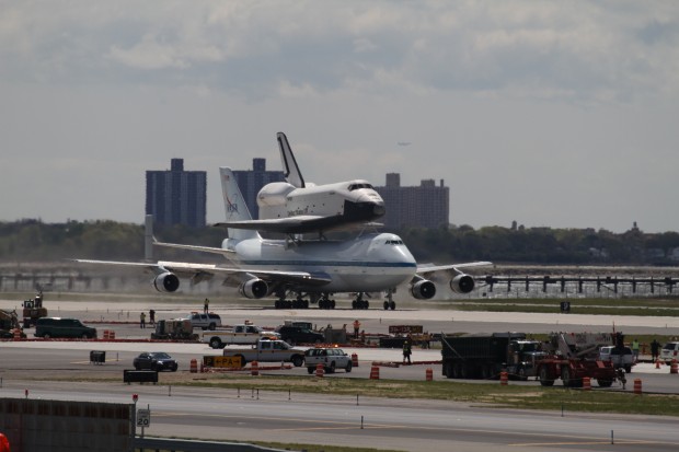 Space Shuttle Enterprise and the Shuttle Carrier Aircraft land at JFK Airport. (Photo by Fred Miler)