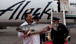 Frank Ragusa, general manager of Ocean Beauty Seafoods, holds up the prized salmon to the crowd. (Photo by Jeremy Dwyer-Lindgren/NYCAviation)
