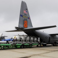 Modular Airborne FireFighting System (MAFFS) being loaded onto an Air Force C-130 Hercules. (Photo by US Air Force)