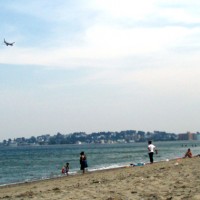 A Southwest Airlines jet on approach to Logan Airport passes over Revere Beach. (Photo by Sara Jeanne Edwards via Flickr, CC BY-NC-SA)