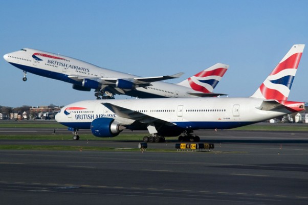 British Airways Boeing 747 and 777s cross paths at Boston's Logan International Airport. (Photo by Eric Dunetz)