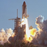 First launch of Space Shuttle Discovery, Mission STS-41-D. (Photo by NASA)
