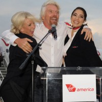 Virgin Group founder Sir Richard Branson celebrates at the launch of PSP service last winter. (Photo by Virgin America)