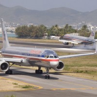 One American 757 lands at St. Maarten while another taxis for departure. (Photo by Mario J. Craig)