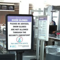 This TSA sign about snow globes is no longer true, but there are still restrictions. (Photo by Scott Beale via Flickr, CC-BY-NC-ND)