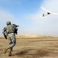 A US Army sergeant launches a AeroVironment RQ-11Raven unmanned aerial vehicle, similar to the drones being sold to the Afghani government. (Photo by Sgt. 1st Class Michael Guillory/US Army)