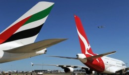 Emirates and Qantas A380 tails. (Photo by AFP)