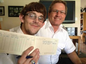 Cap'n Dillon shows off his logbook alongside Cap'n Aux. 