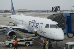 The ground crew readies "Blue State of Mind" for its return flight to Boston