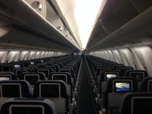 Looking down the aisle of a Condor B767.