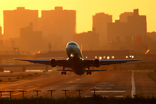 Delta 767-300 departing runway 13 at sunset. (Photo by Author)