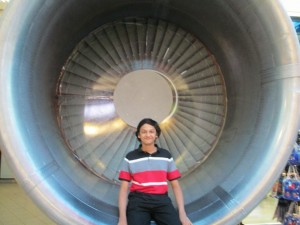 Aditya sits in the nacelle of a Pratt & Whitney JT8D