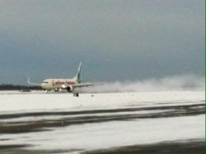 Caribbean Airlines 3017 rolling out on JFK's runway 31R, the first airline to arrive at the airport post-blizzard.