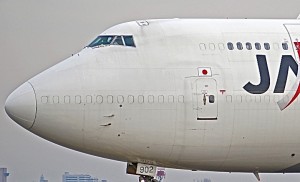 A Japan Airlines Boeing 747 passenger-to-freighter conversion featuring aluminum window plugs. (Photo credit: Flickr)