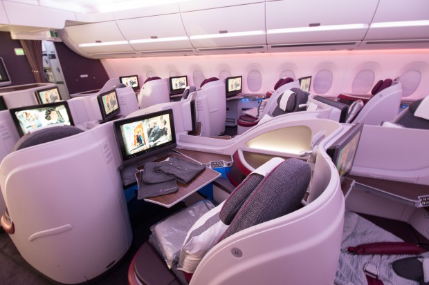 The inflight entertainment screens and tray tables at each business class seat are very large.