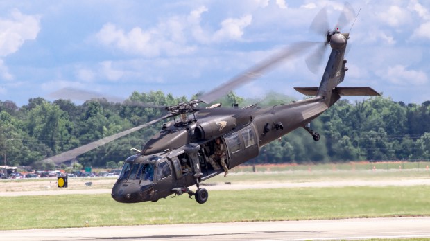 The UH-60 launches off the tarmac with the JTAC team onboard to complete the exfiltration. 
