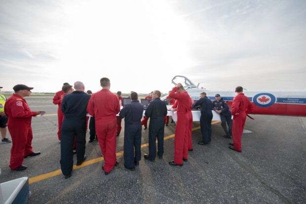 The Royal Canadian Air Force Snowbirds debrief after flying their jets into Republic Airport.