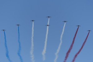 With their signature tricolored smoke in trail, the team enters the showbox from behind the crowd. 