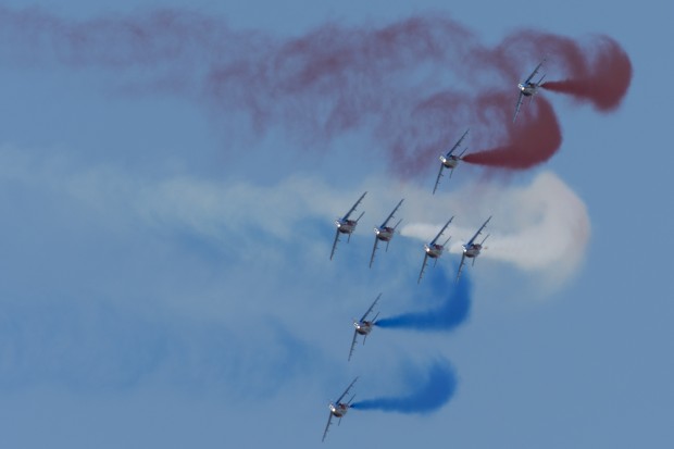 The team enters the show box from the right after a formation change.