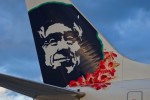 Famous Native Alaskan on Alaska Airlines planes wears a lei in honor of the new Hawaii flights.