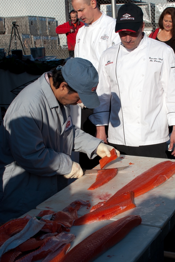Fileting the salmon. (Photo by Tad Carlson)