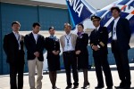 ANA staff pose in front of the new plane.
