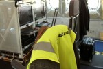 A workstation with a jacket on the seat.
