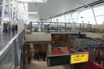 The central section of Terminal 4, which was previously open from the 1st floor to the roof, is being covered over with the new centralized security checkpoint.