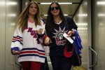 Two excited passengers walk down the jetway to board their Newark-bound flight. (Photo by Matt Molnar/NYCAviation)